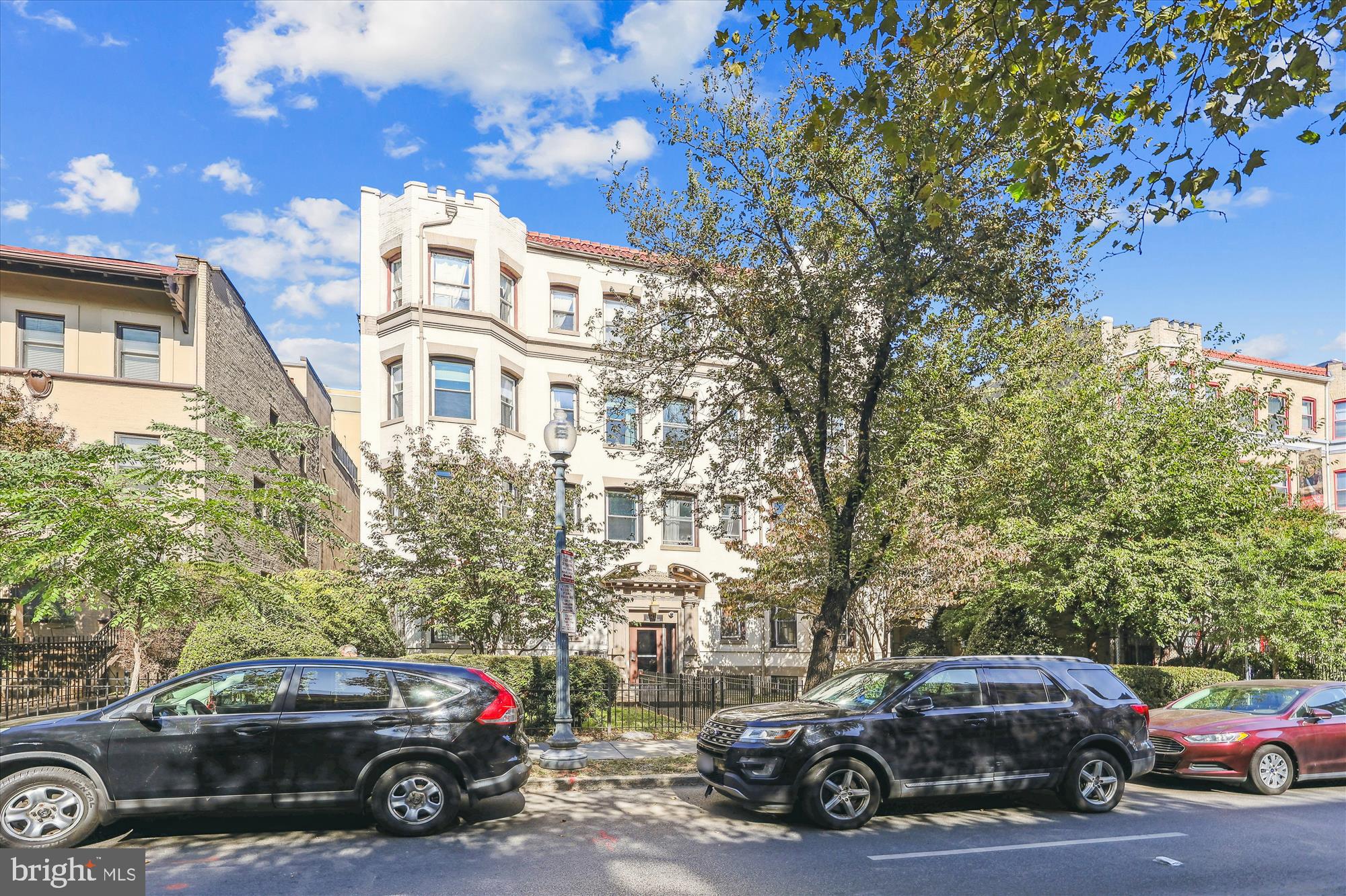 a view of a cars parked in front of a building