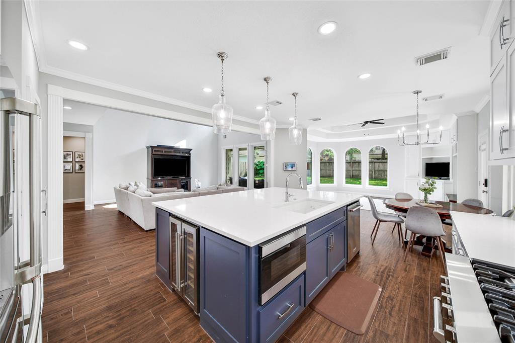 The kitchen has been completely remodeled, featuring a large Quartz Island and updated pendant and recessed lighting. So elegant and convenient for daily activities and entertaining