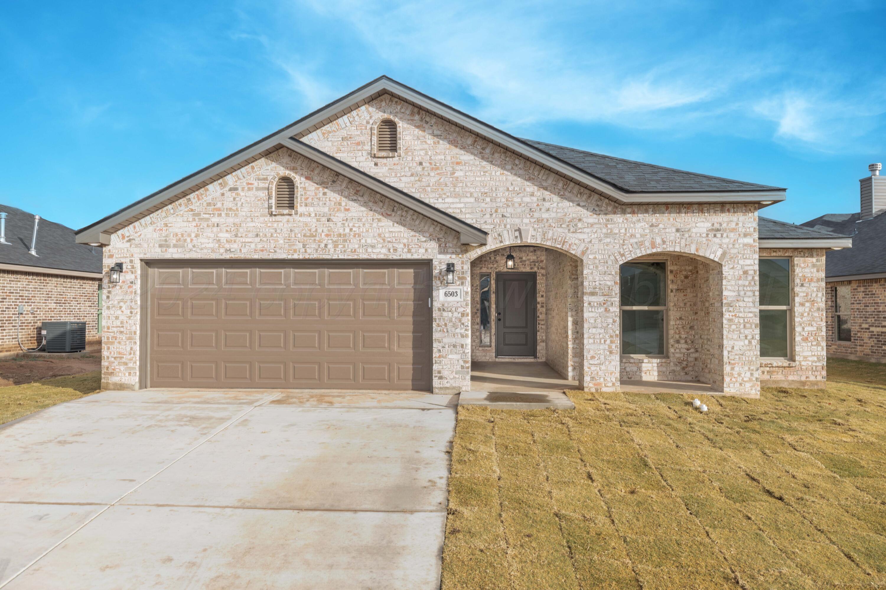 a front view of a house with a garage