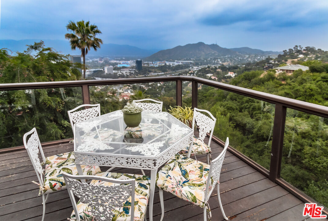 a view of a balcony with mountain view