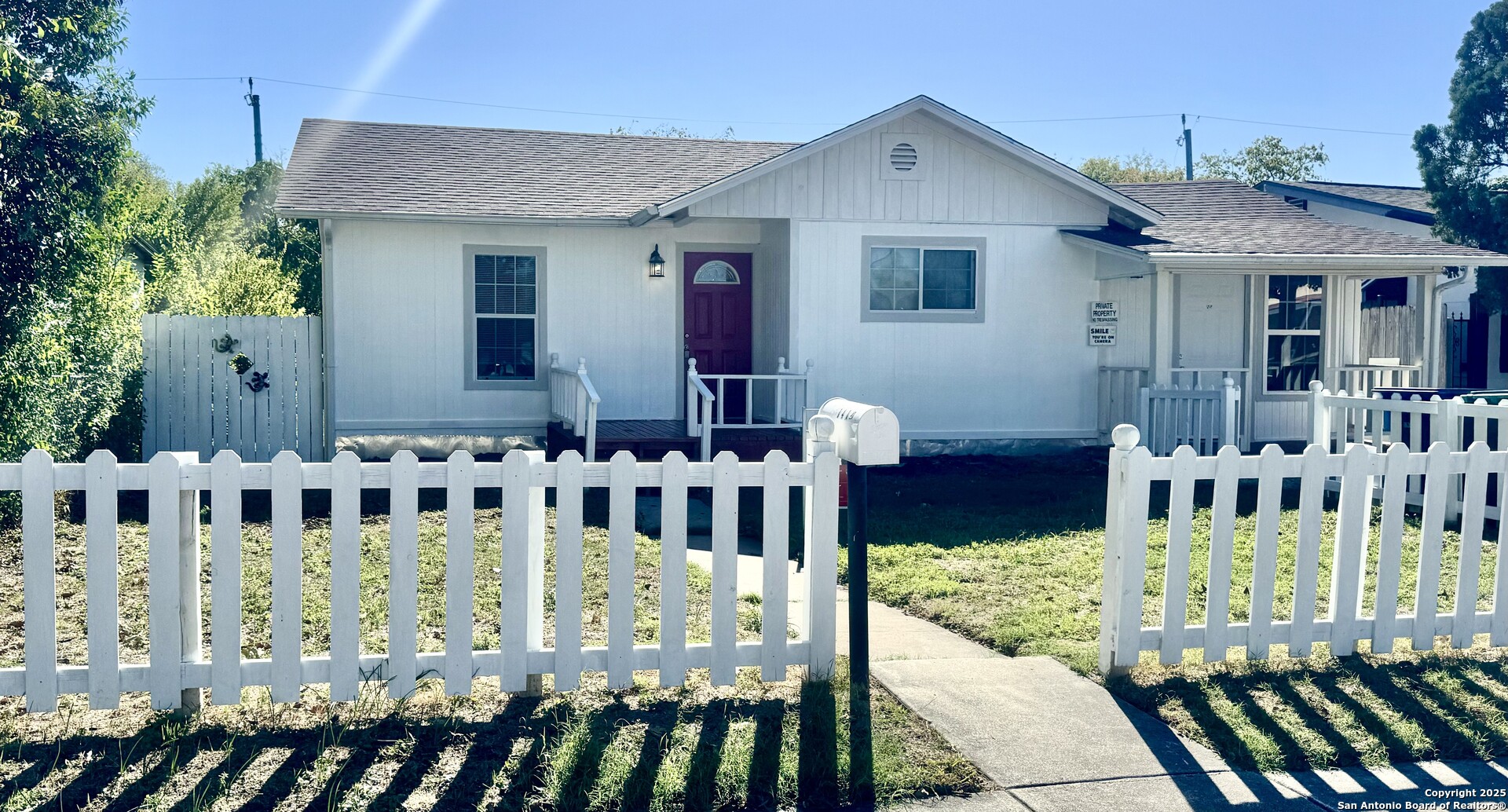 a front view of house with deck of furniture