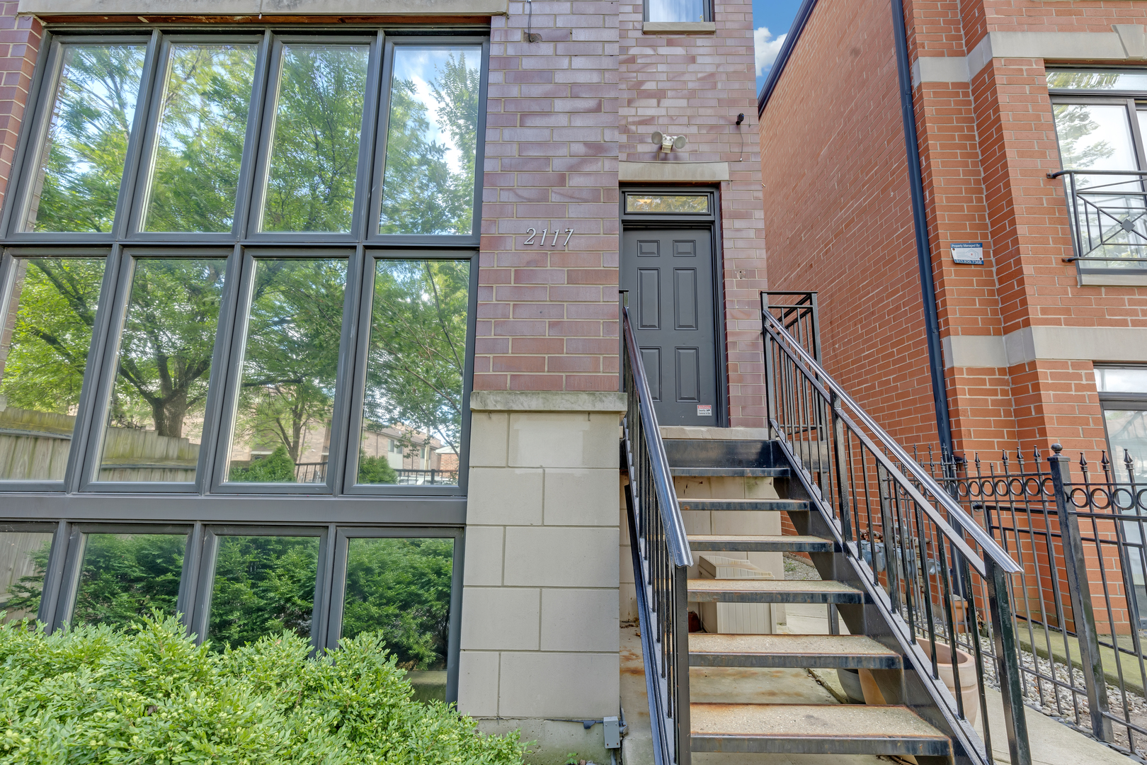 a view of staircase with wooden floor and windows