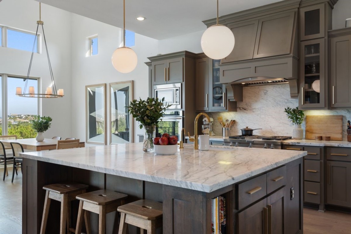 a kitchen with a table and chairs in it