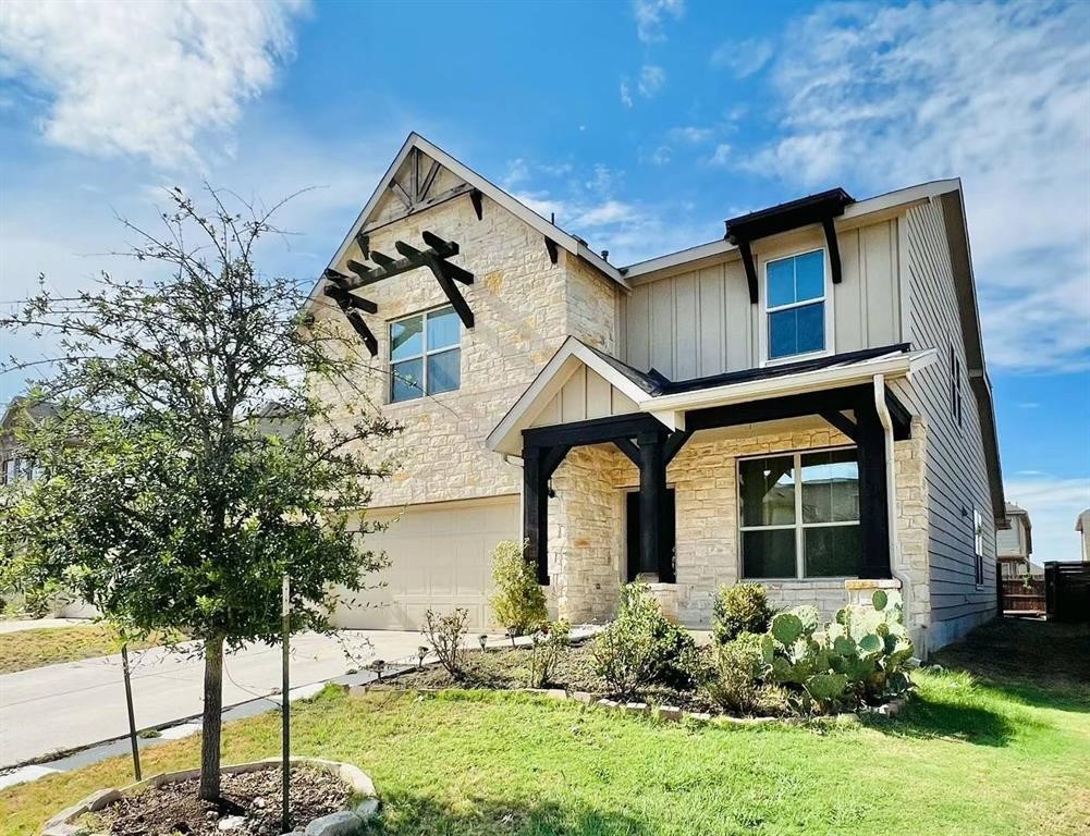 front view of a house with a yard