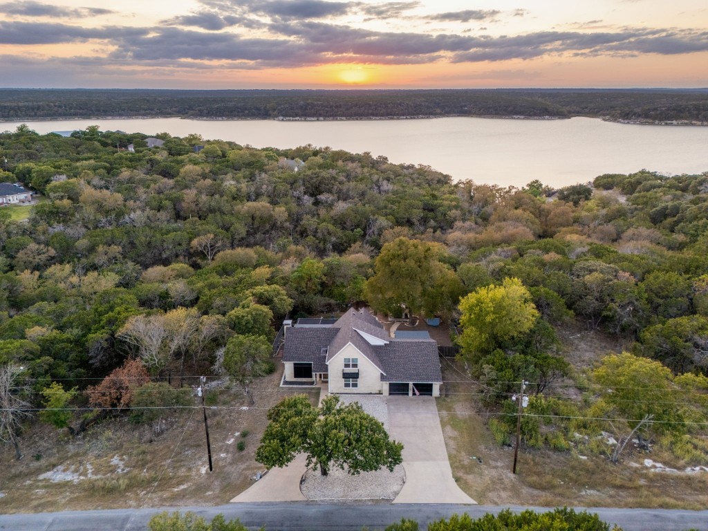 an aerial view of house with ocean view