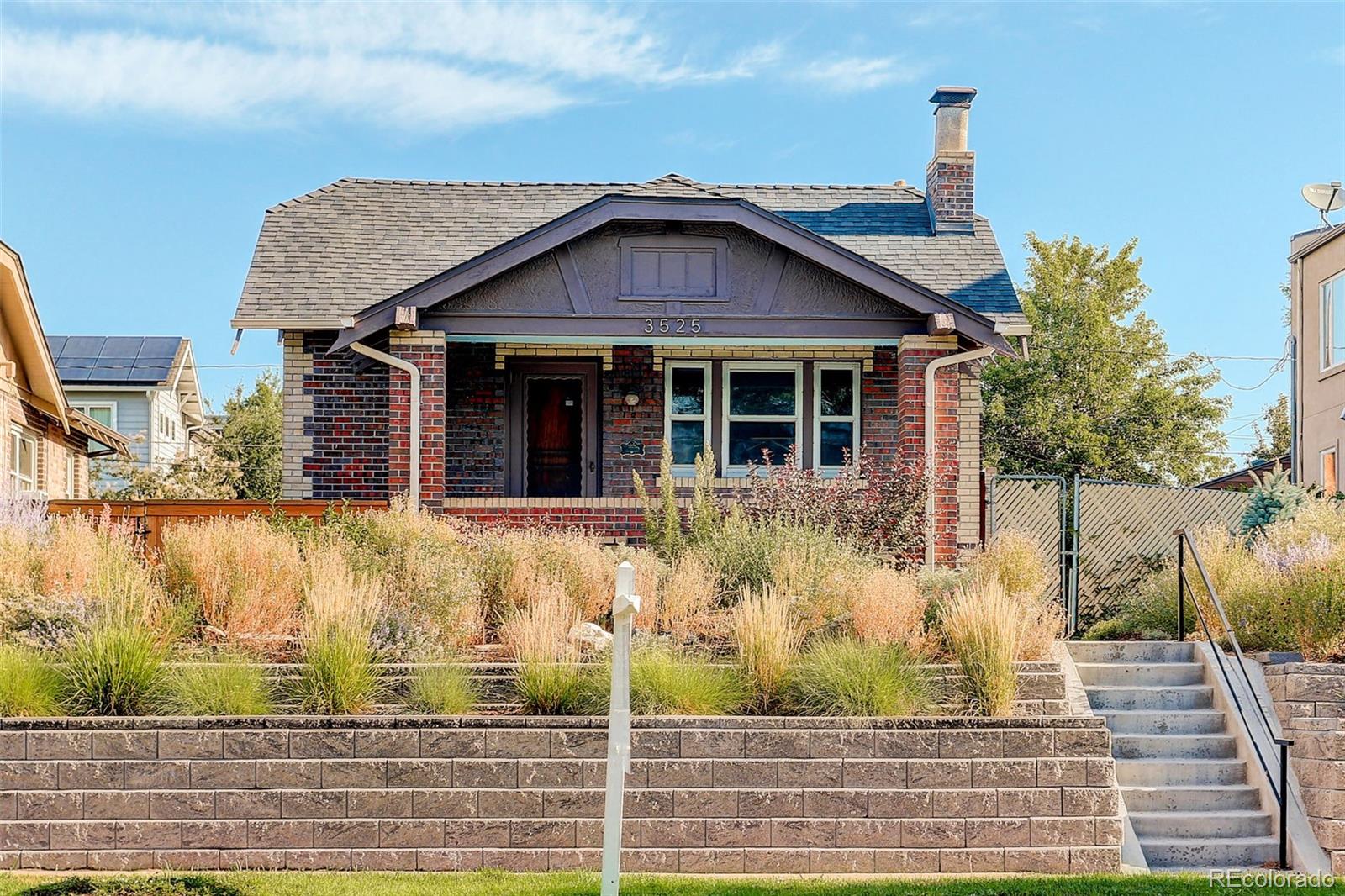 a view of front of house with a small yard