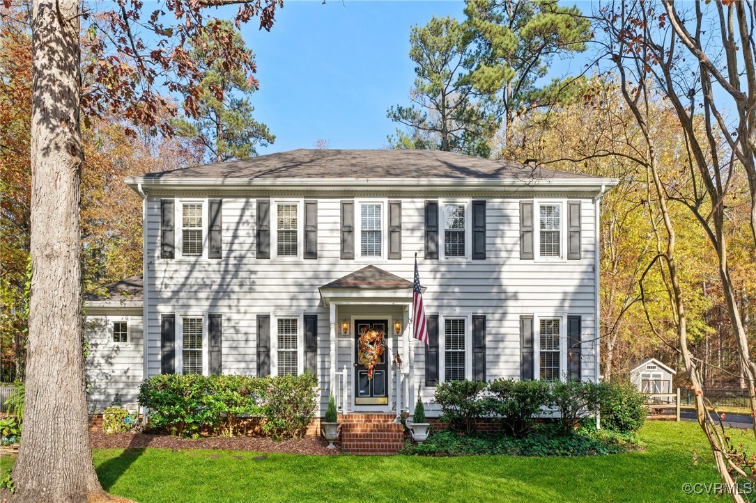 front view of a house with a yard