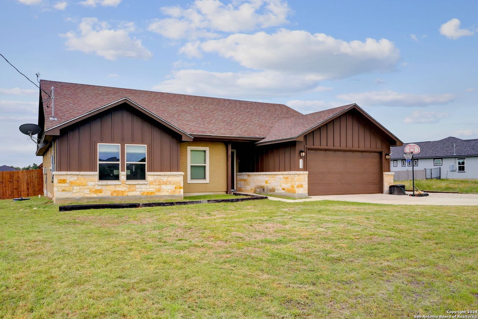 a big house with yard in front of it