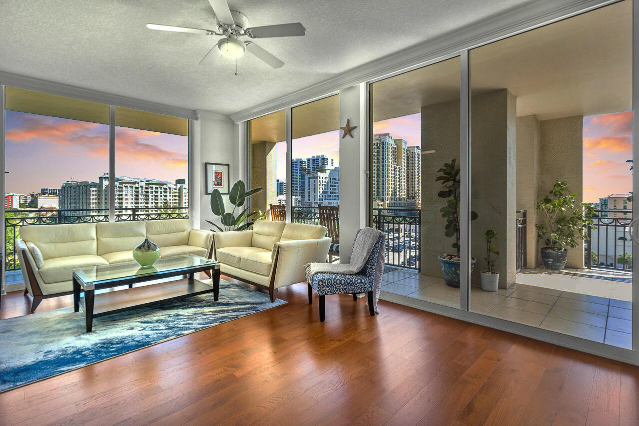 a living room with couch and a floor to ceiling window