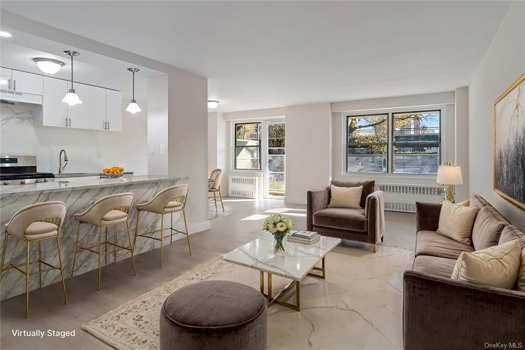 Living room featuring radiator heating unit and sink