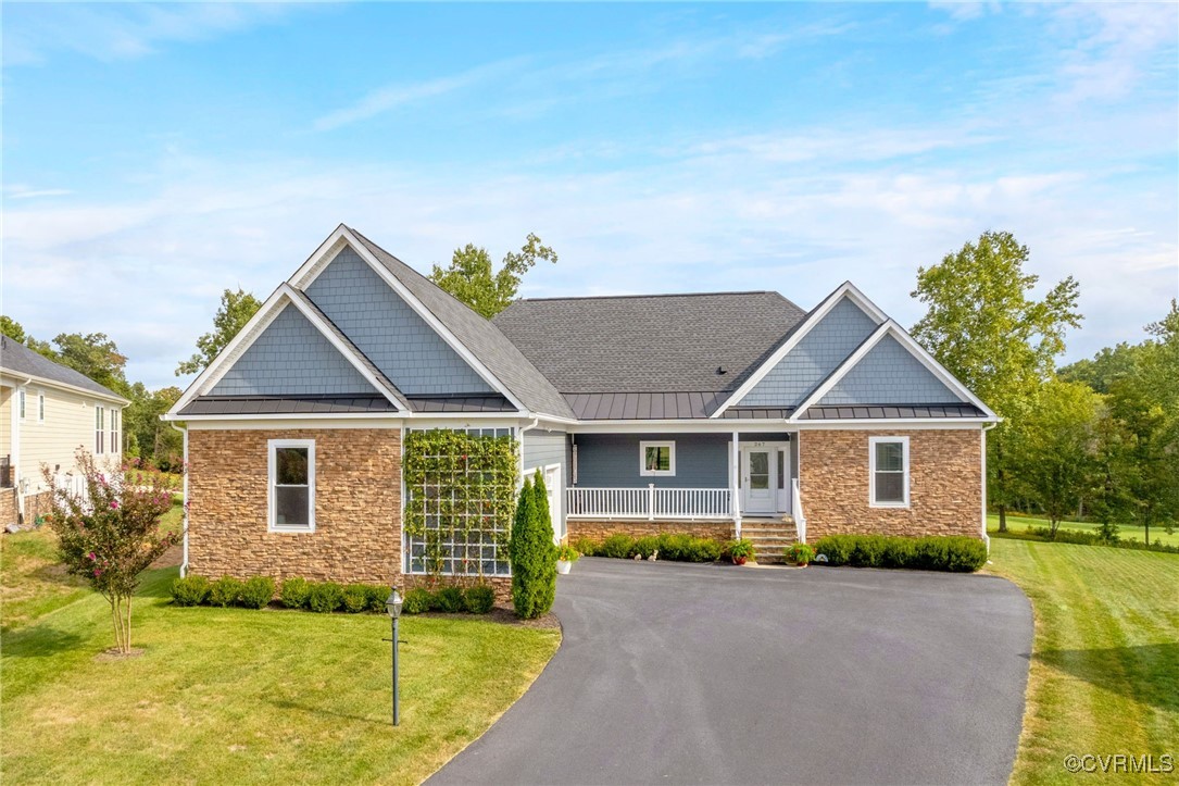 Craftsman-style house featuring covered porch and