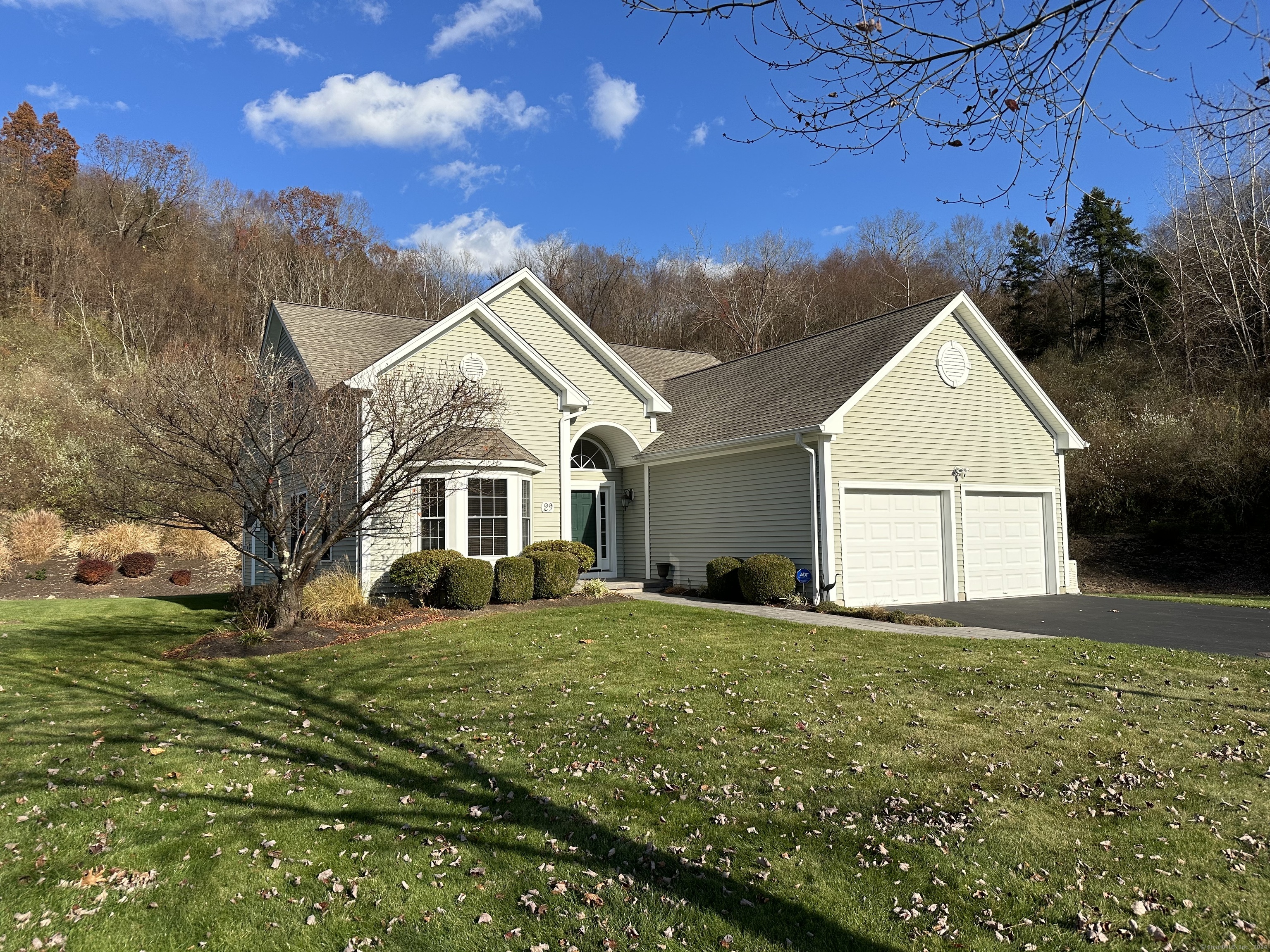 a front view of a house with a yard