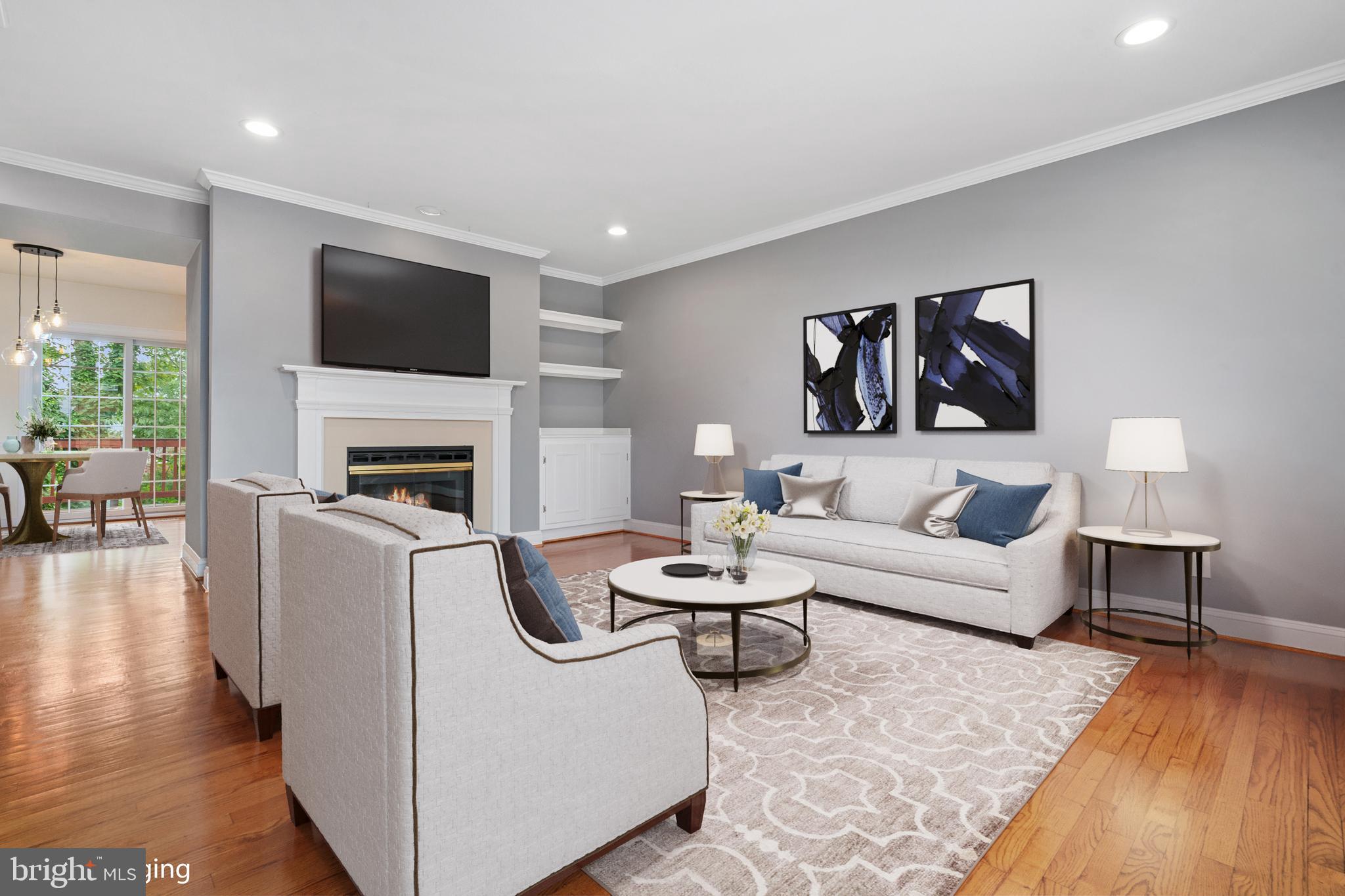 a living room with furniture fireplace and a flat screen tv