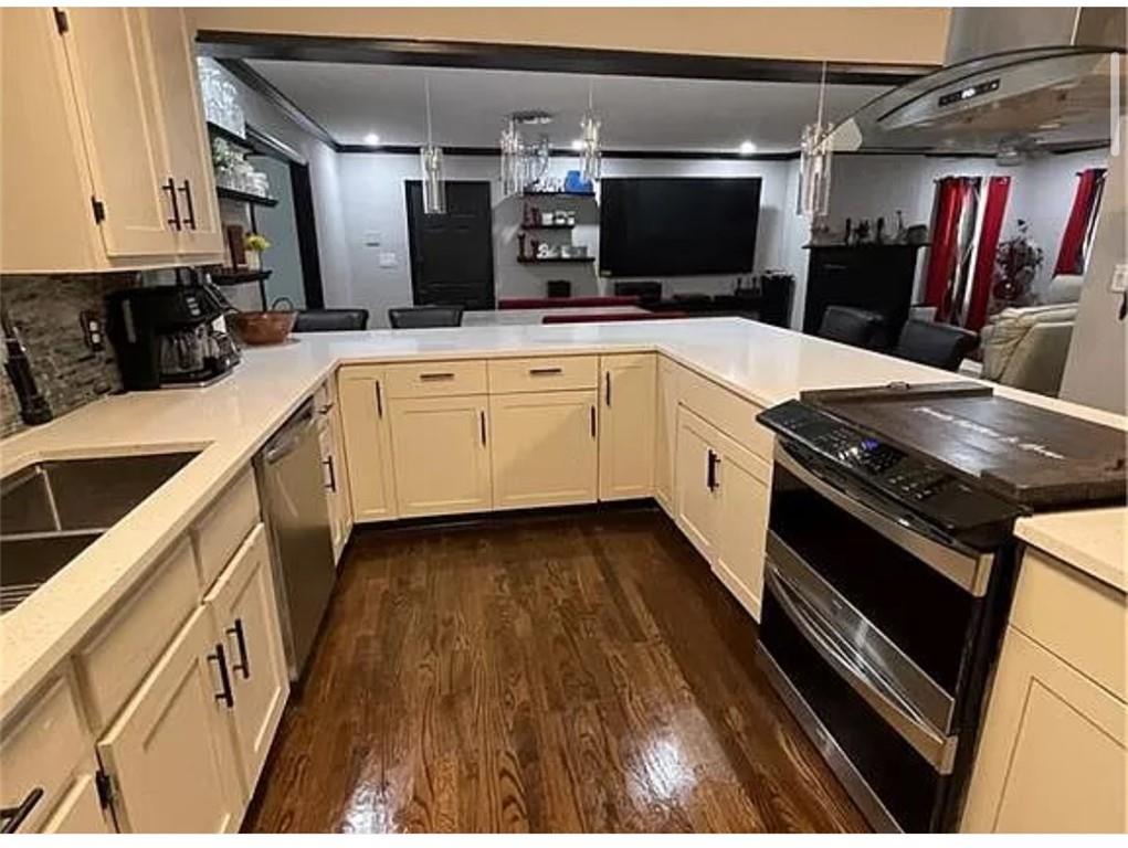 a kitchen with a stove and a sink