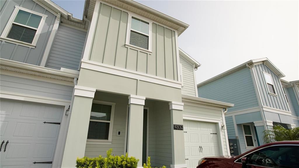 a front view of a house with garage