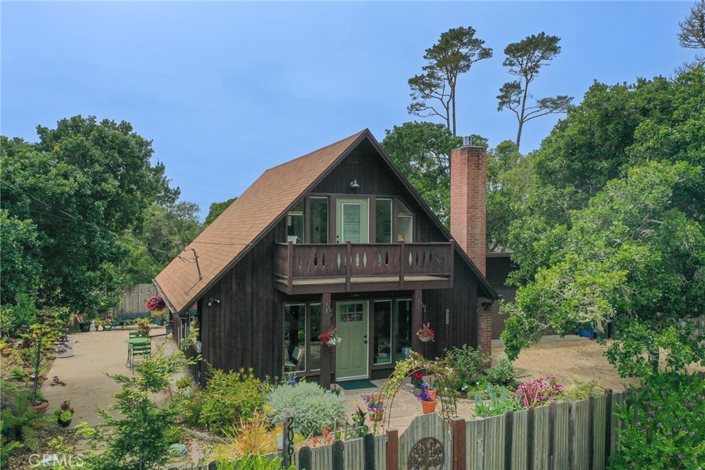 Sweet 1960's Chalet, with three bedrooms, two 3/4 baths, a 2 car garage with a Tesla EV charger.  This home boasts a beautifully gardened, 7230 sf. lot, completely fenced in.