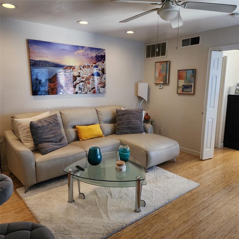 a living room with furniture and a rug