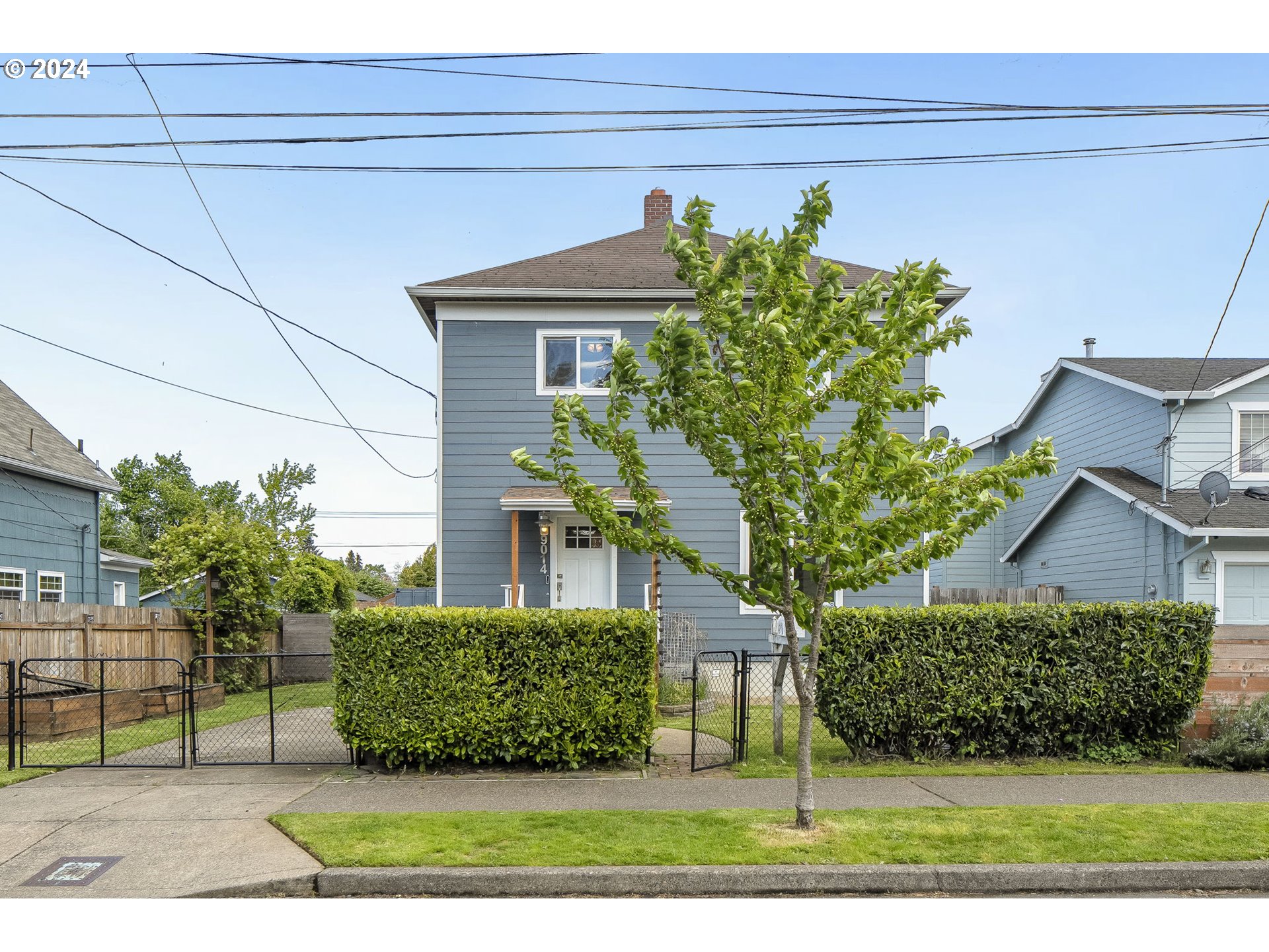 a front view of a house with garden