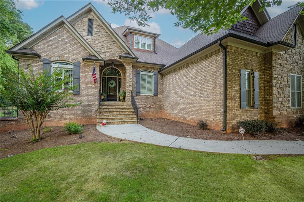 a front view of a house with garden