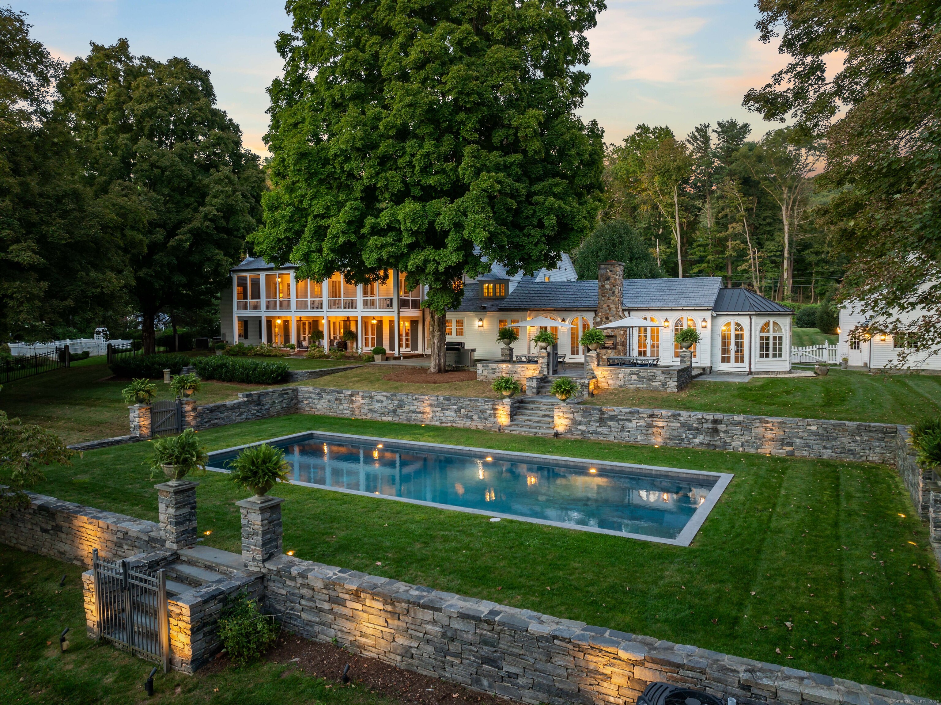 swimming pool view with a seating space and a garden view