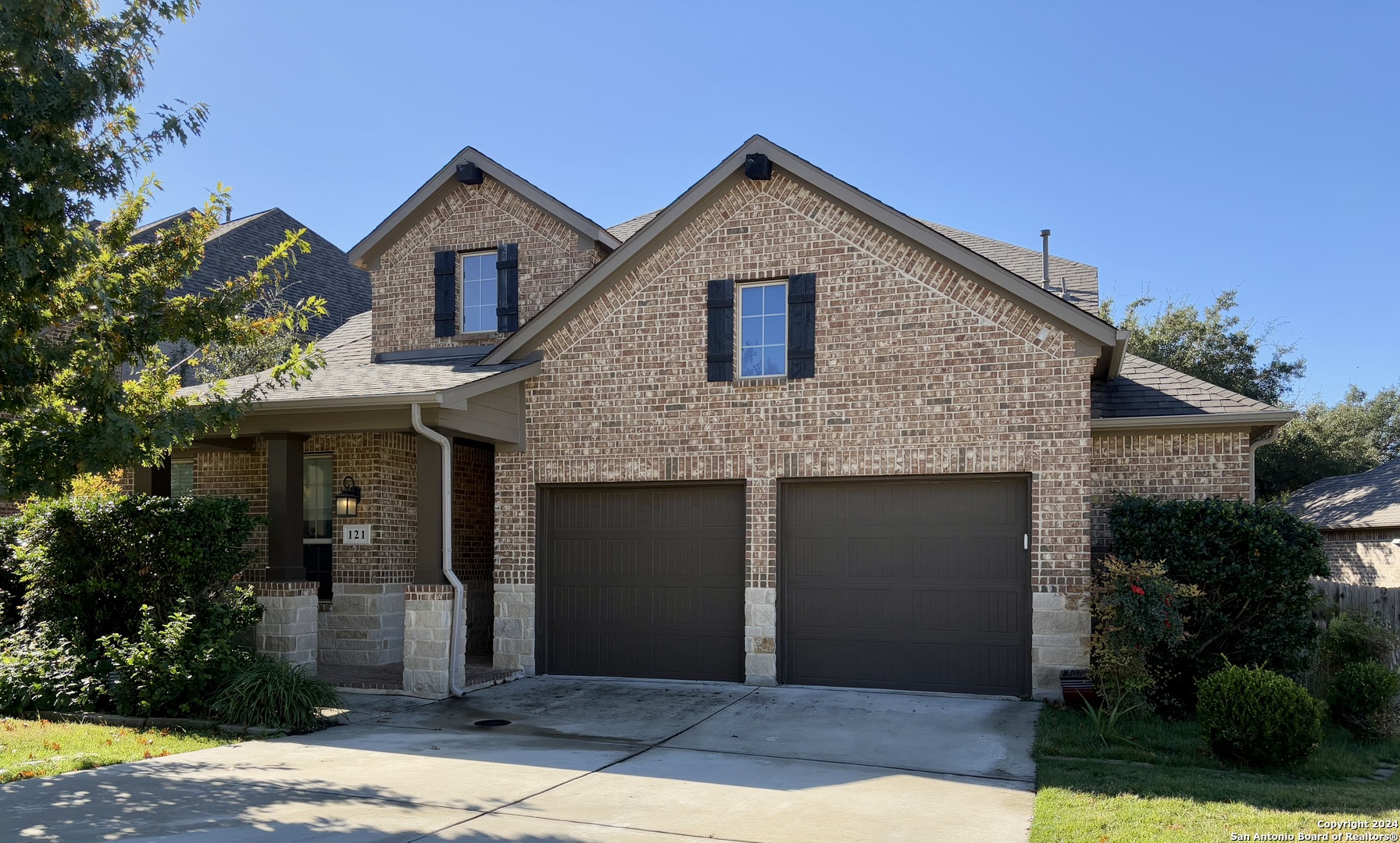 a front view of a house with yard