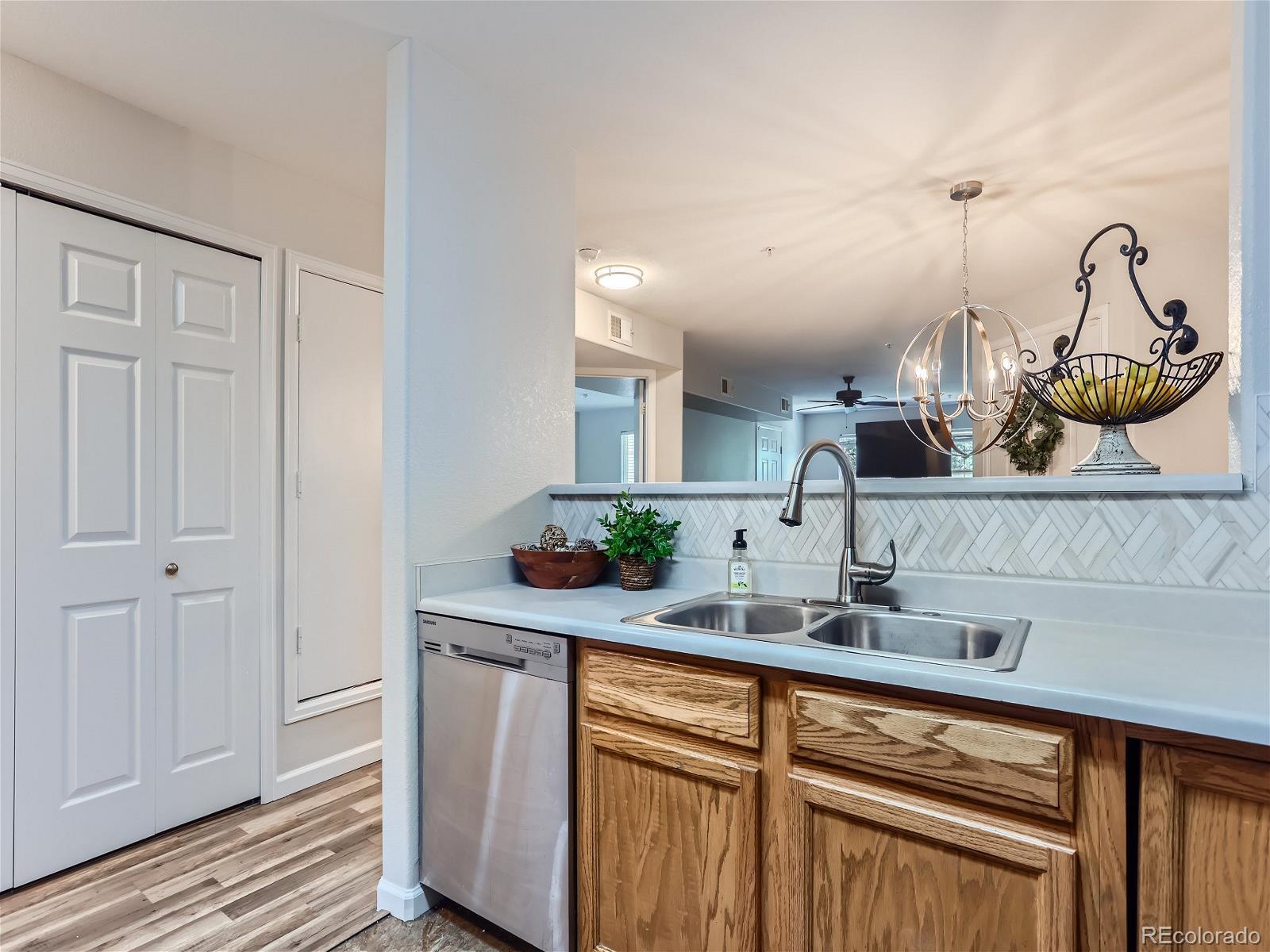 a kitchen with a sink and cabinets