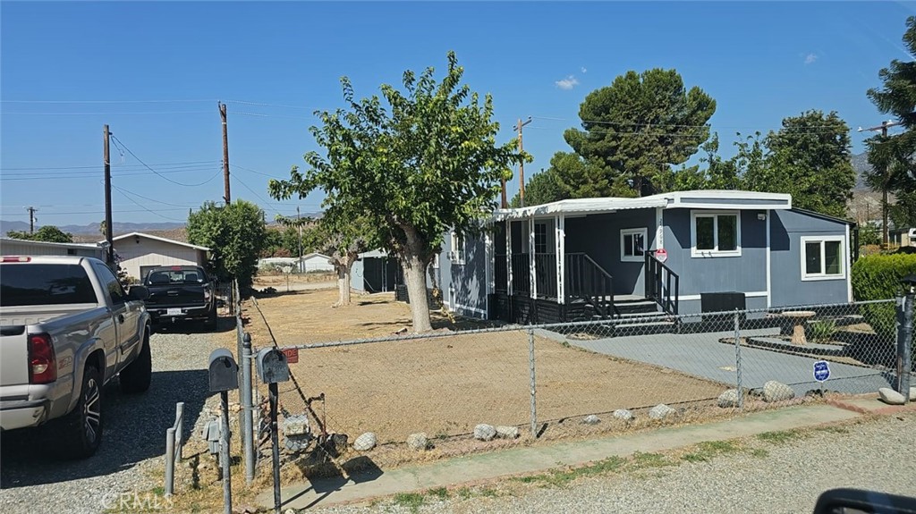 a view of a house with outdoor kitchen