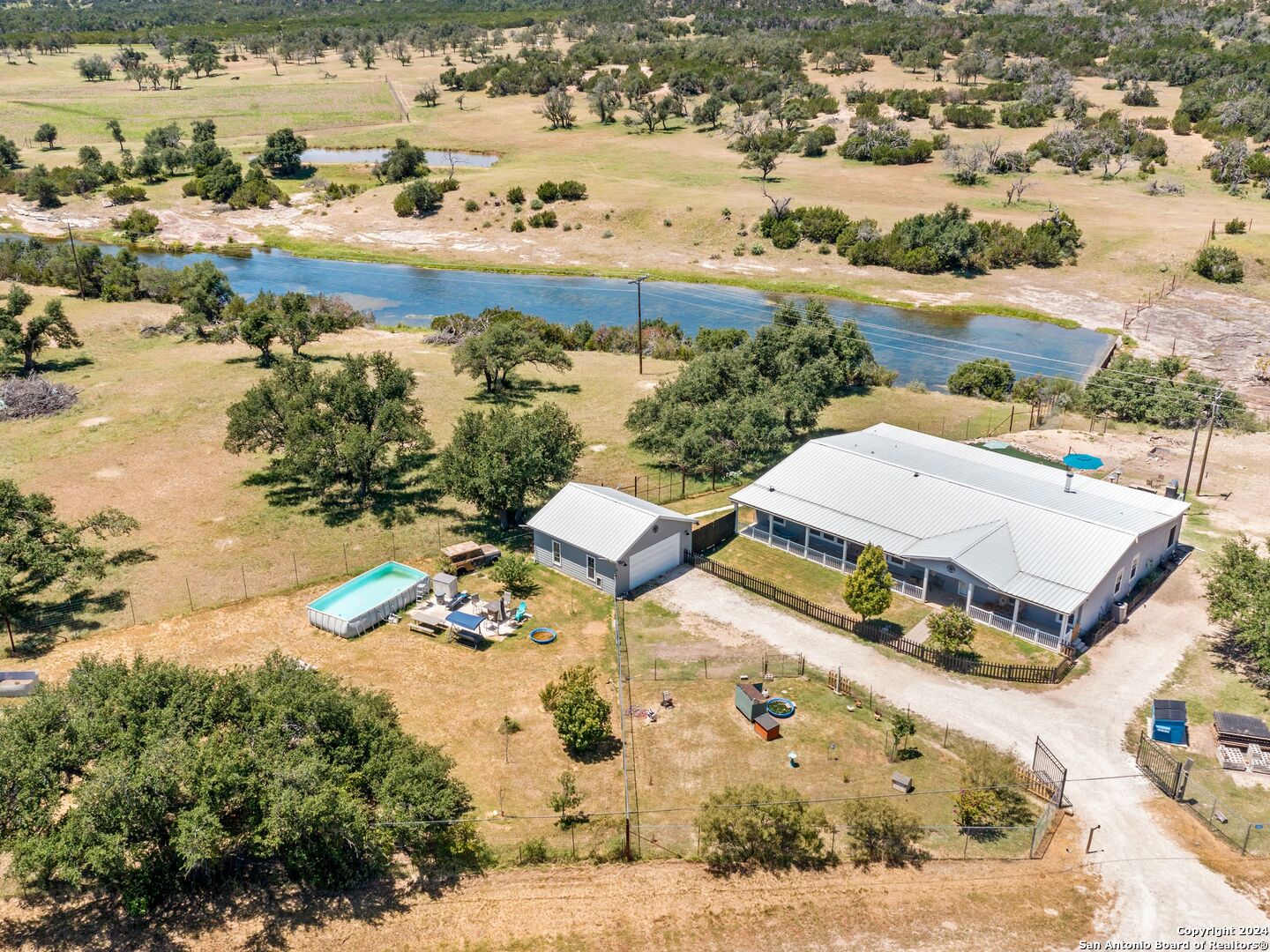 an aerial view of residential houses with outdoor space