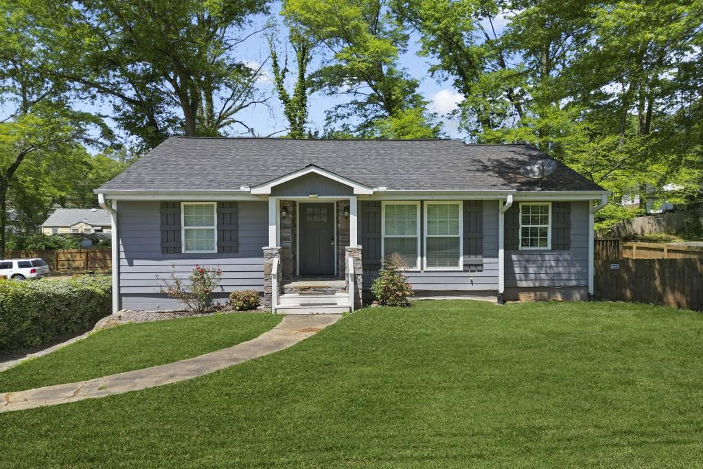 a front view of a house with a yard table and chairs