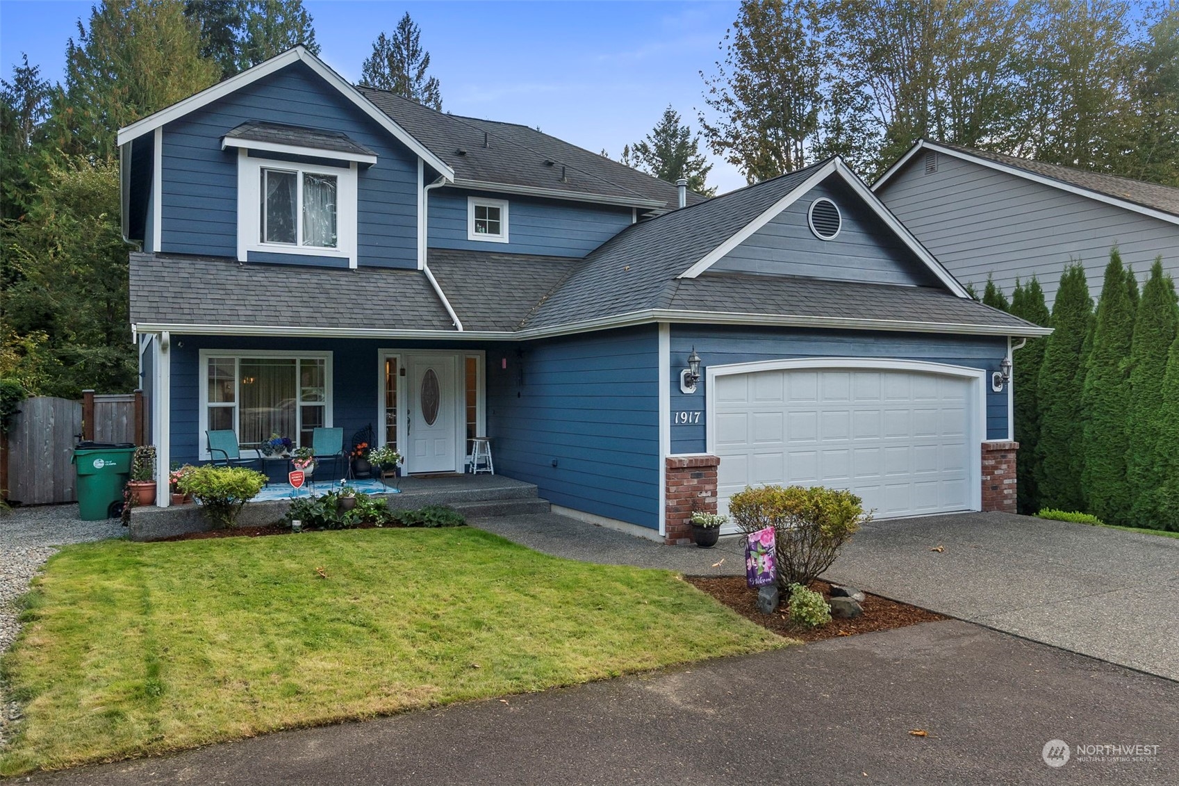 a front view of a house with garden