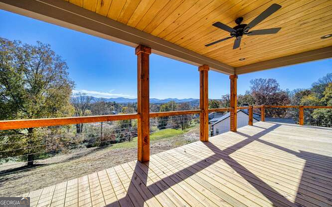 a view of a balcony with wooden floor