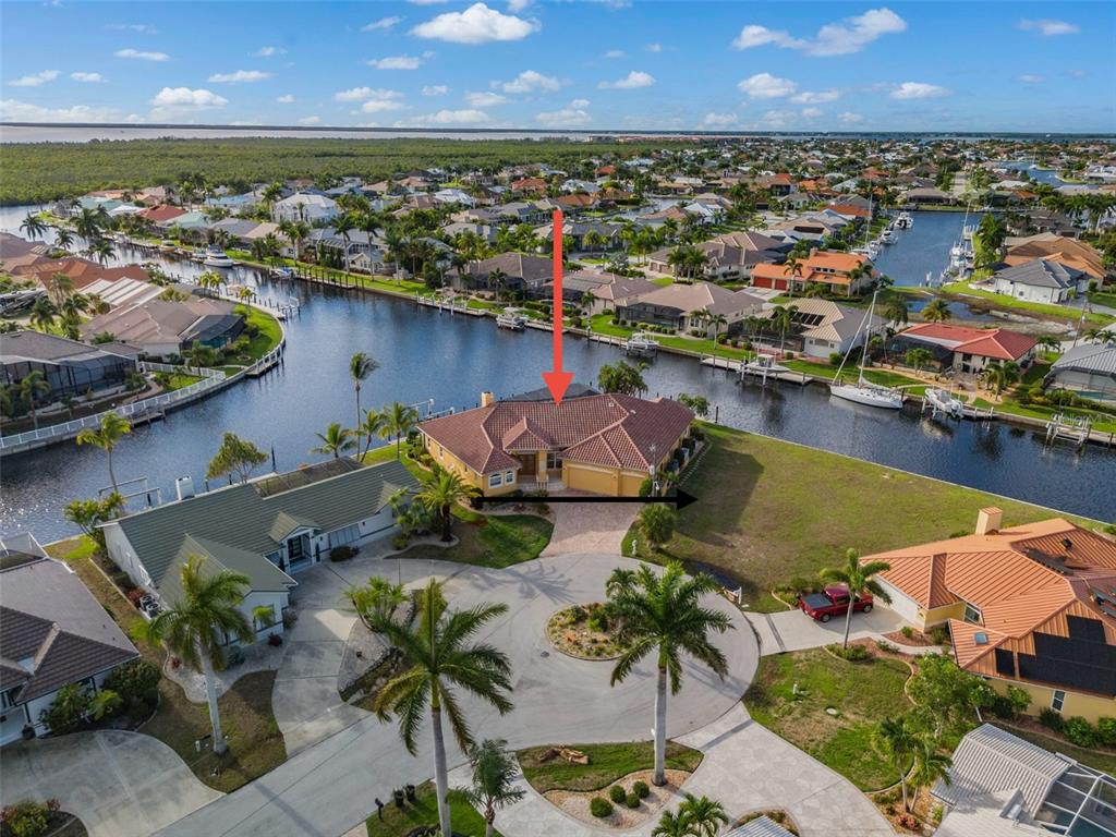 an aerial view of a house with a lake view