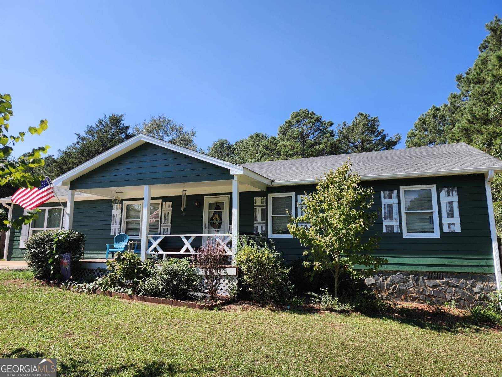 front view of a house with a yard