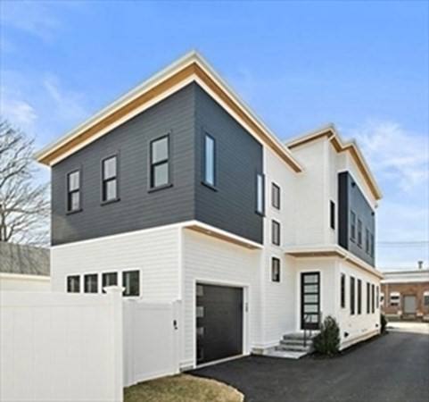 a front view of a house with a garage