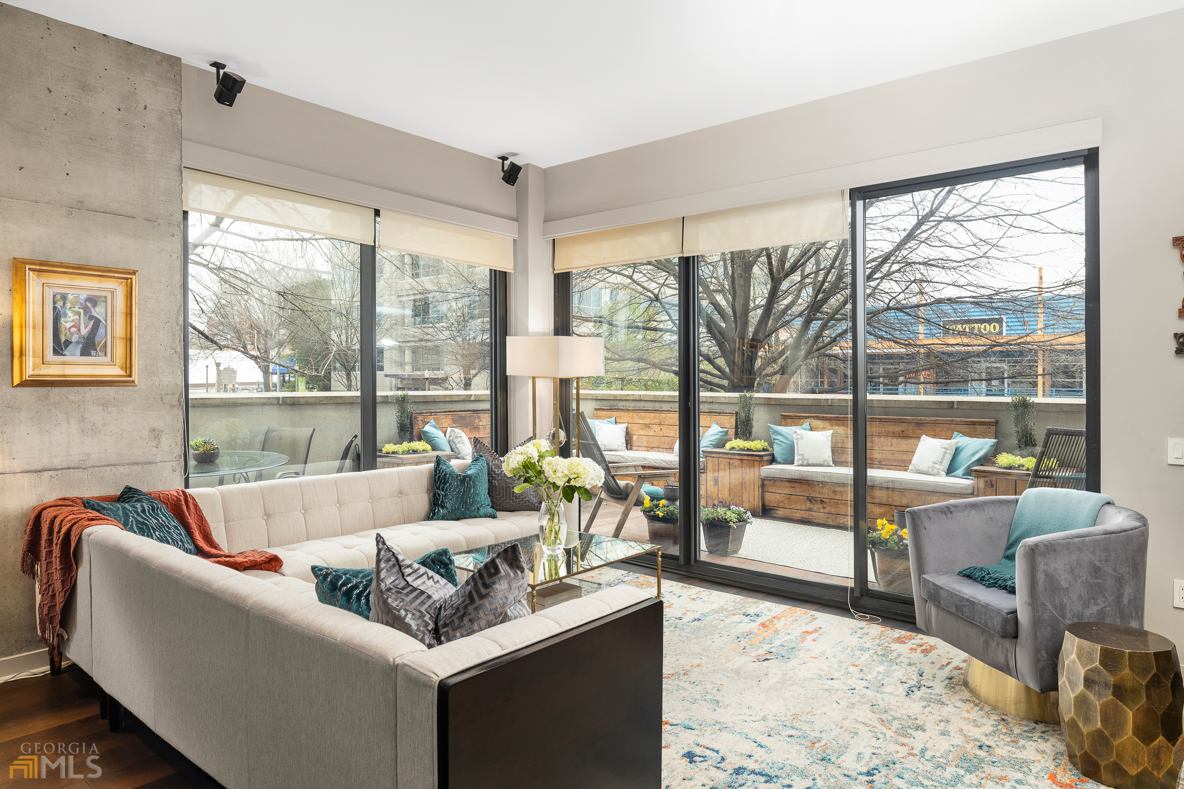 a living room with couch and a large window