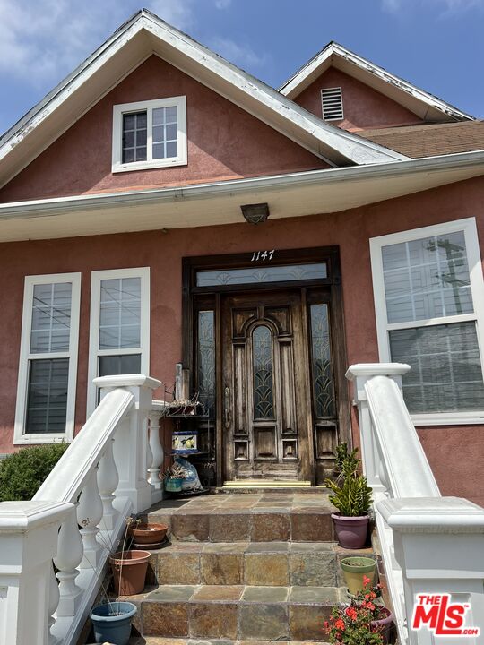 a front view of a house with a porch