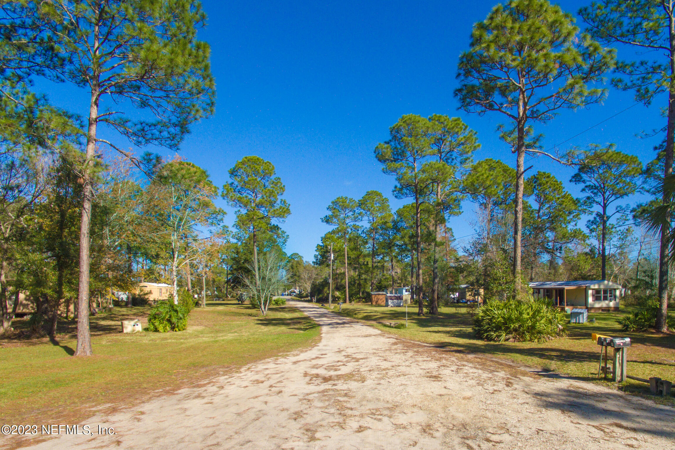 a view of street along with trees