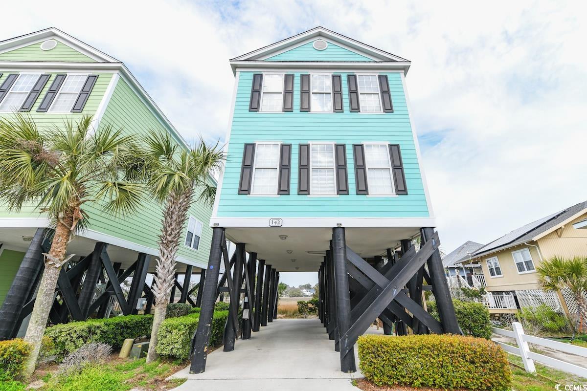 Beach home featuring a carport