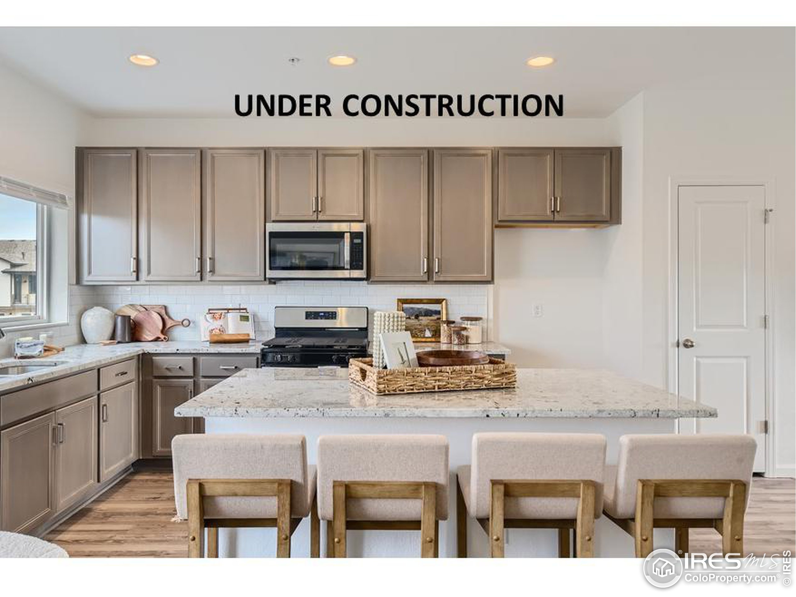 a kitchen with a stove a sink and a refrigerator