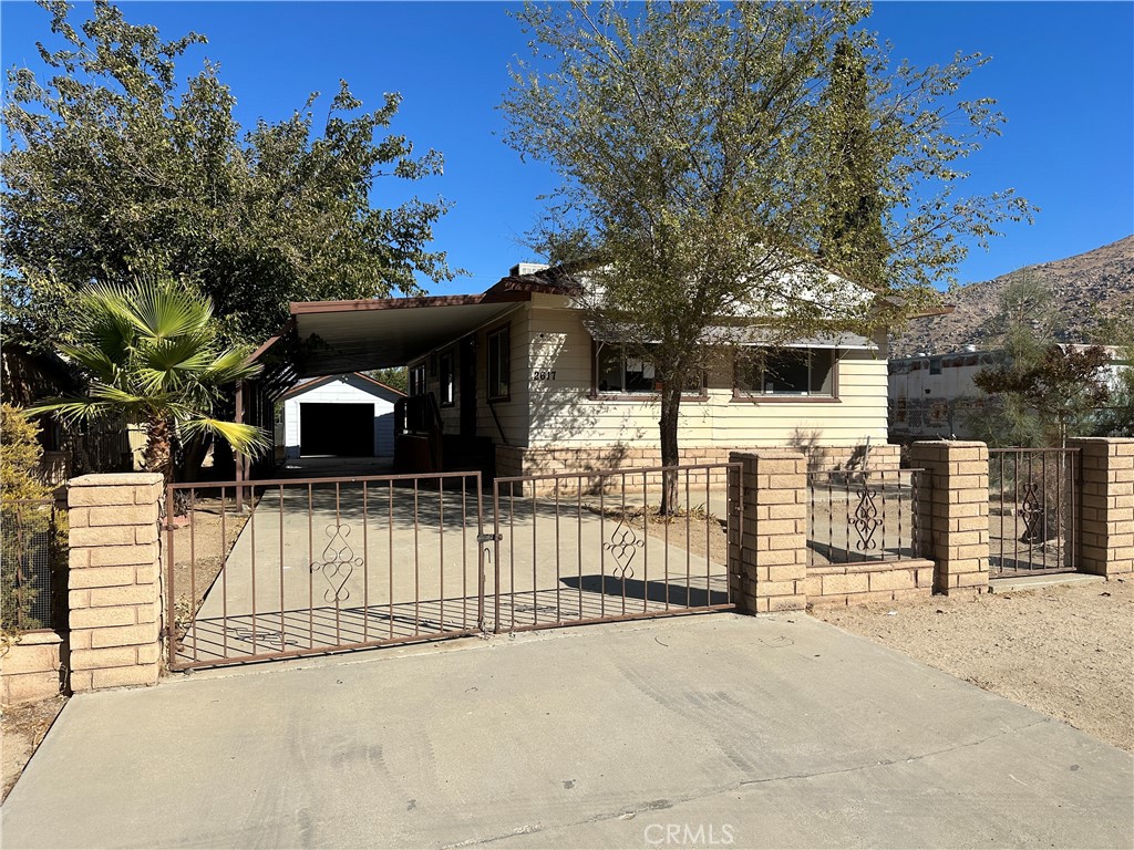 a view of a house with a fence