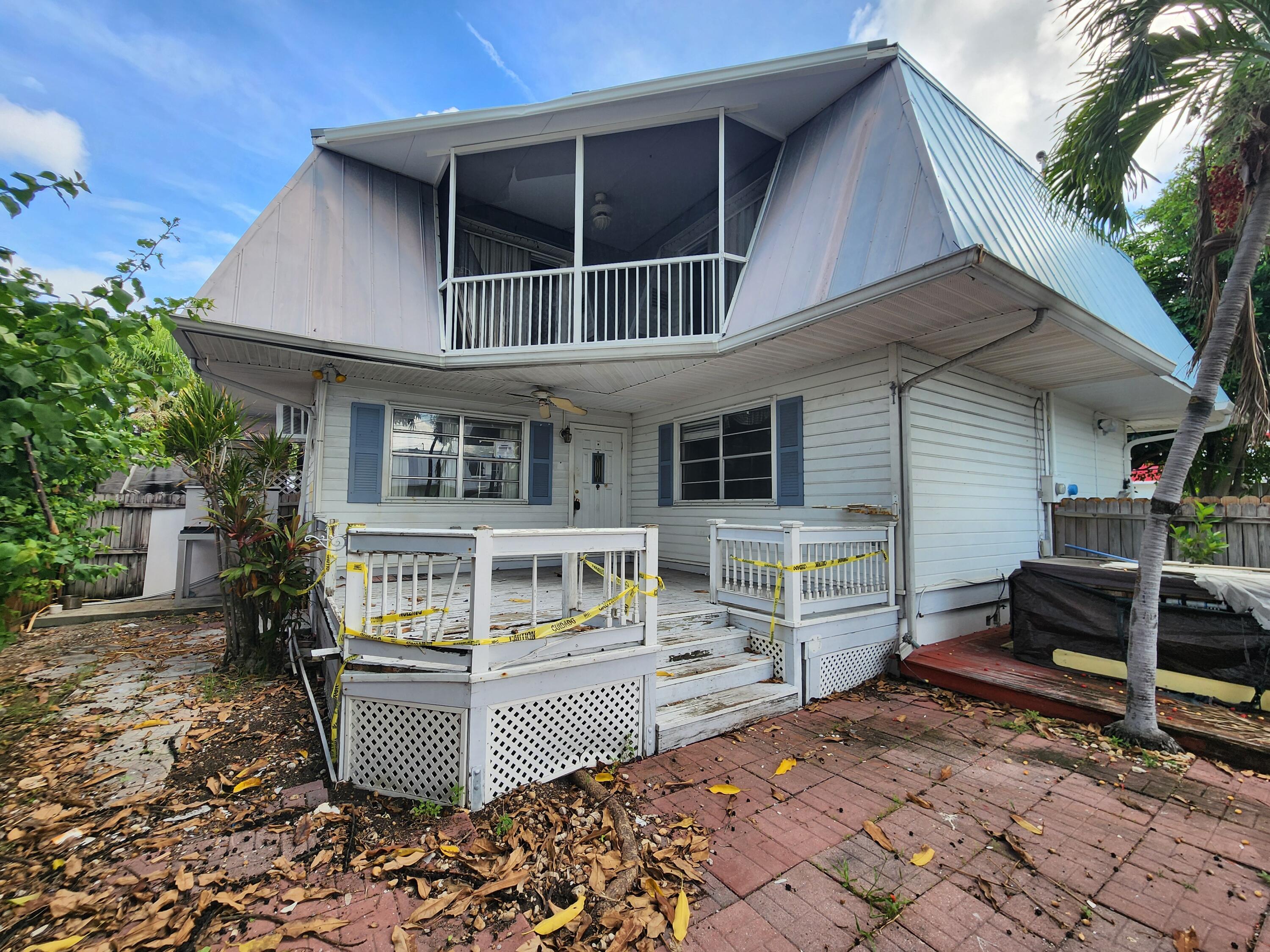 a front view of a house with parking space