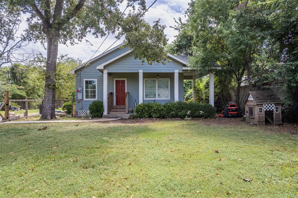 front view of a house with a garden