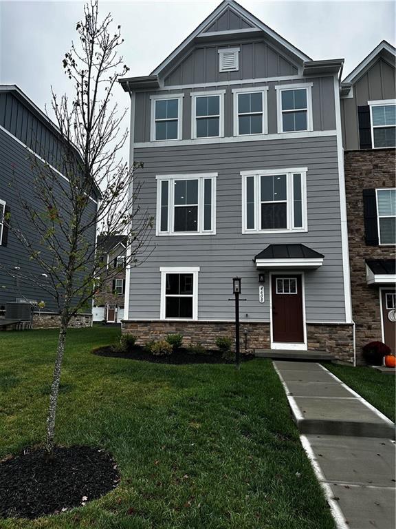 a front view of a house with a yard