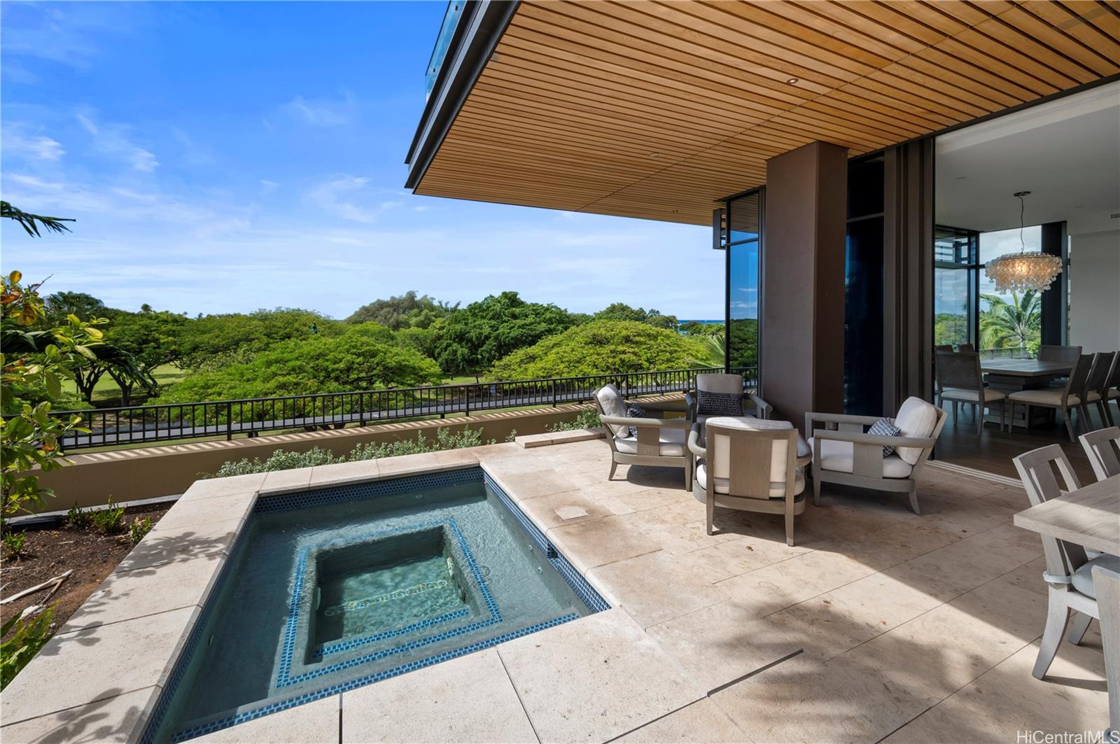 a view of swimming pool with outdoor seating