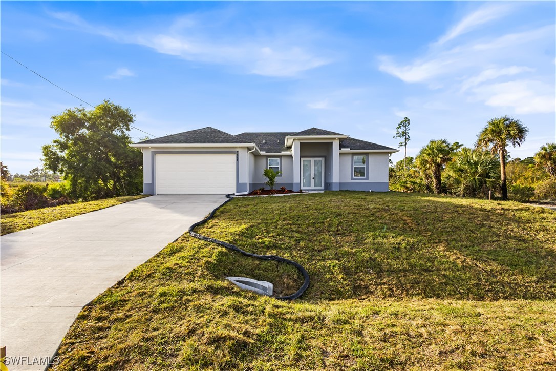 a view of a house with a yard