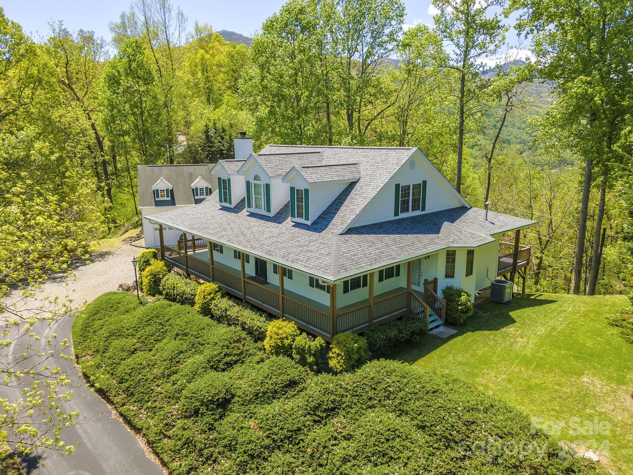 a aerial view of a house with a big yard