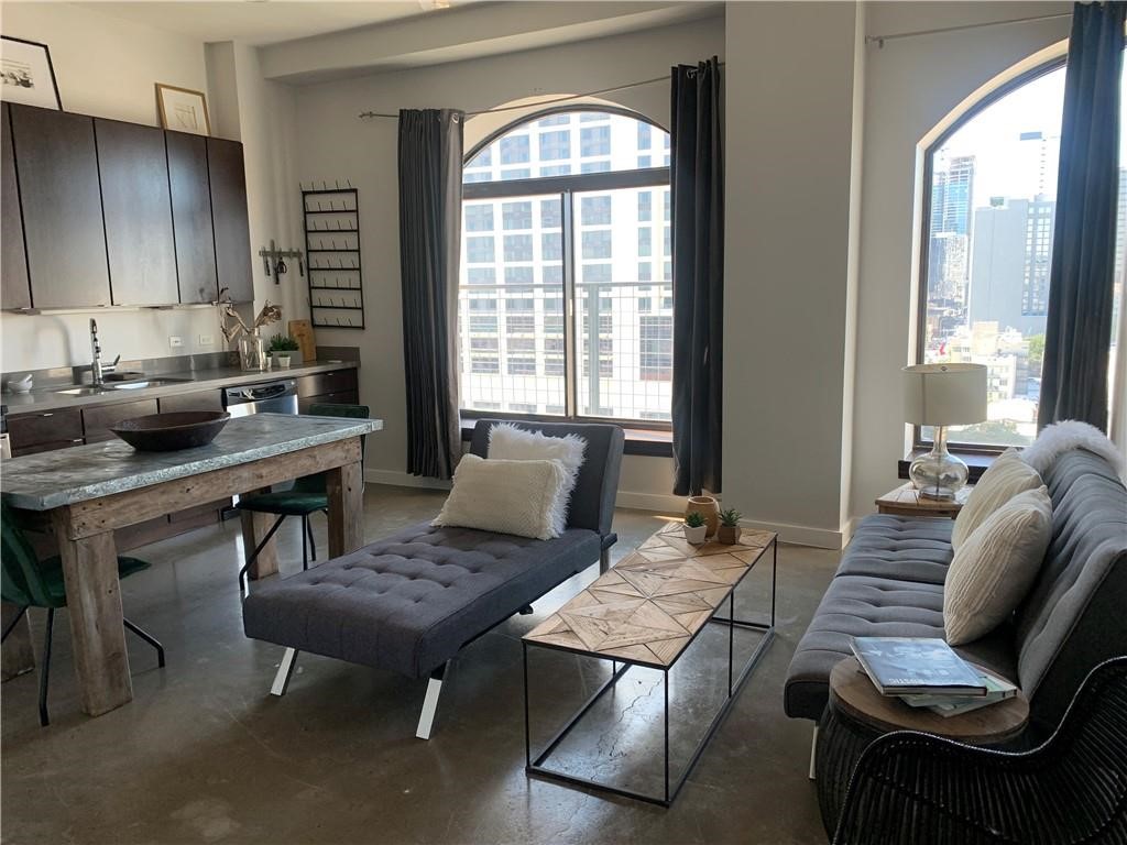 a living room with furniture and a window