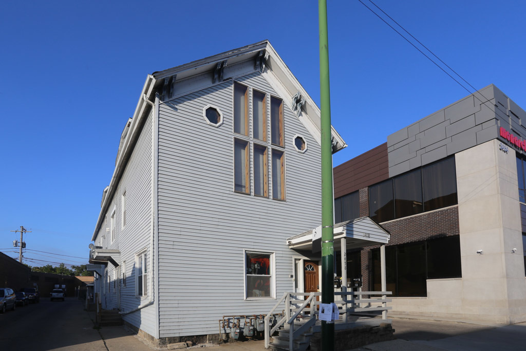 a front view of a house with patio