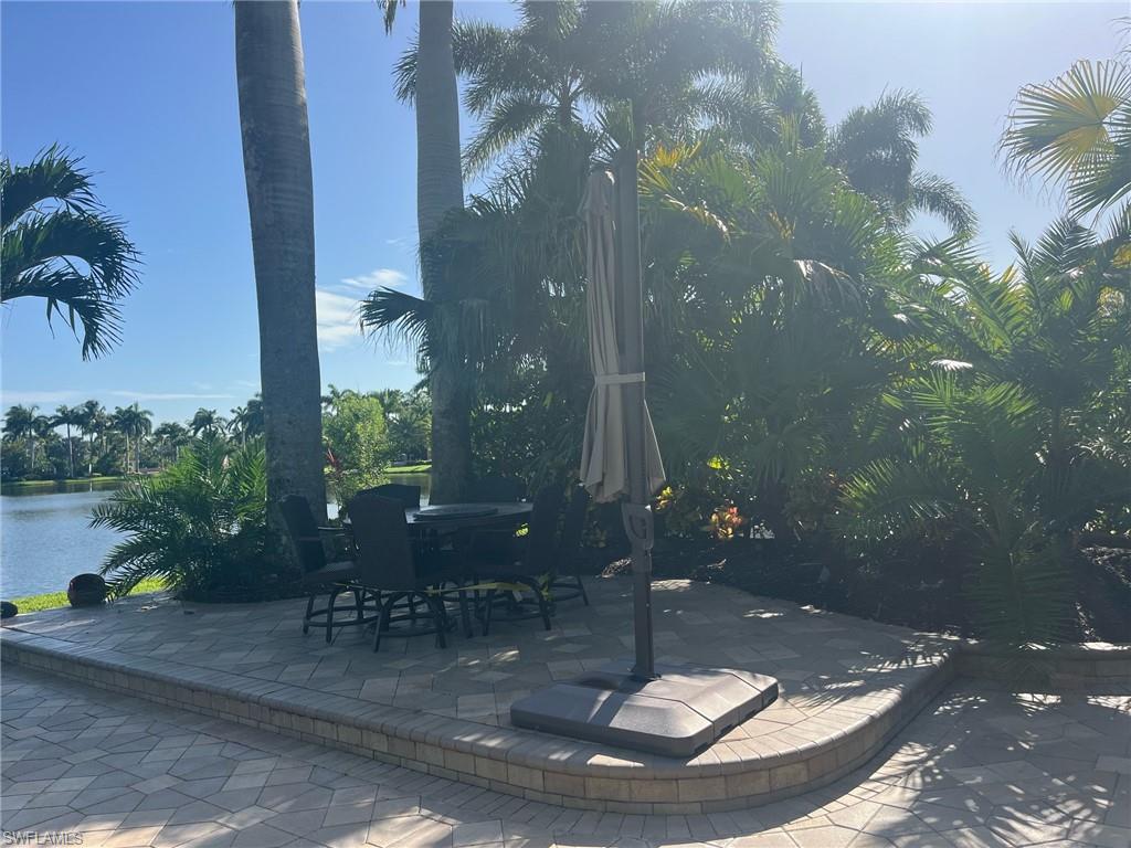 View of patio / terrace with a water view