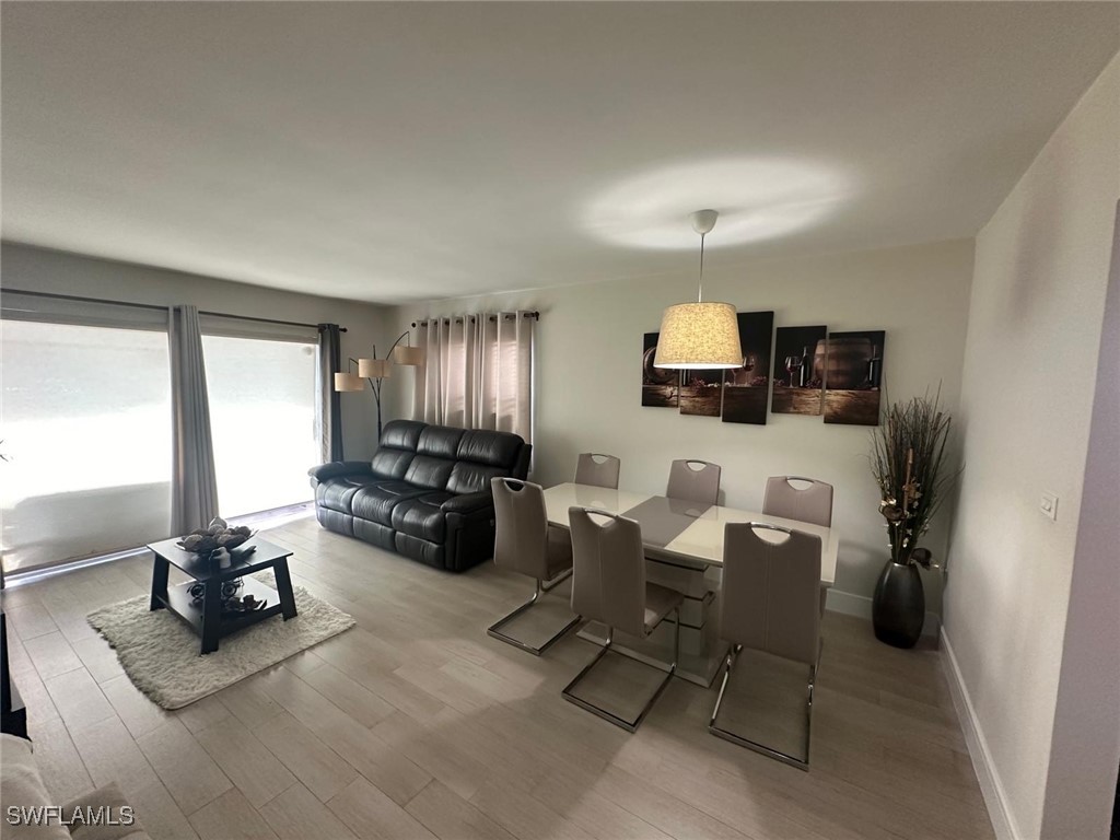 a living room with furniture rug and window